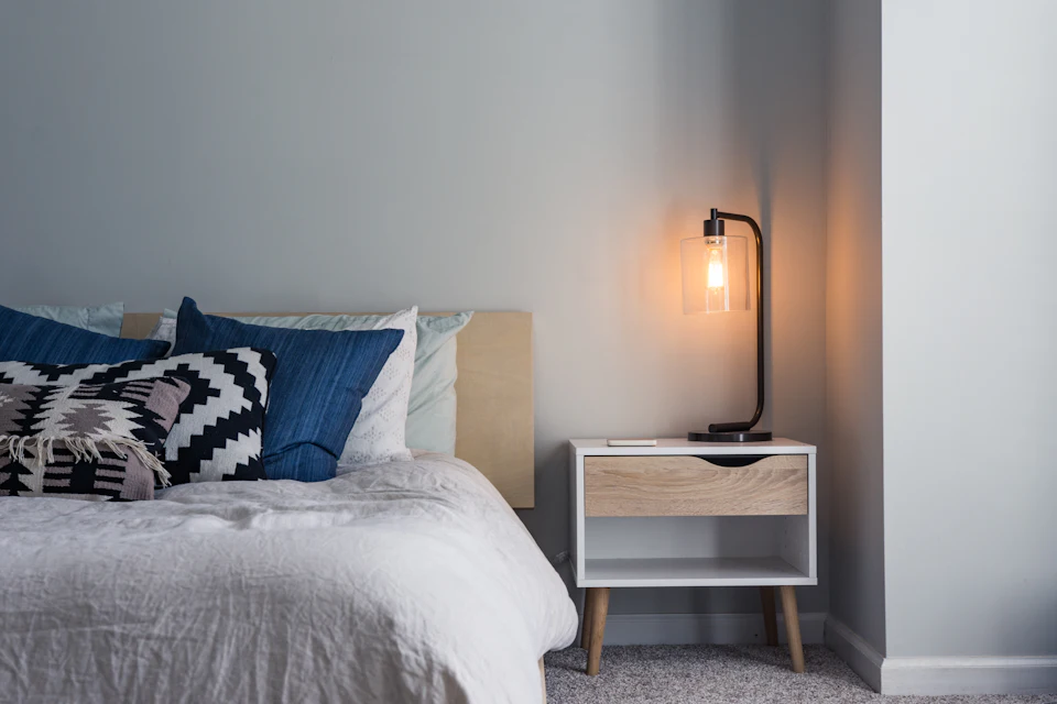 Black table lamp on nightstand