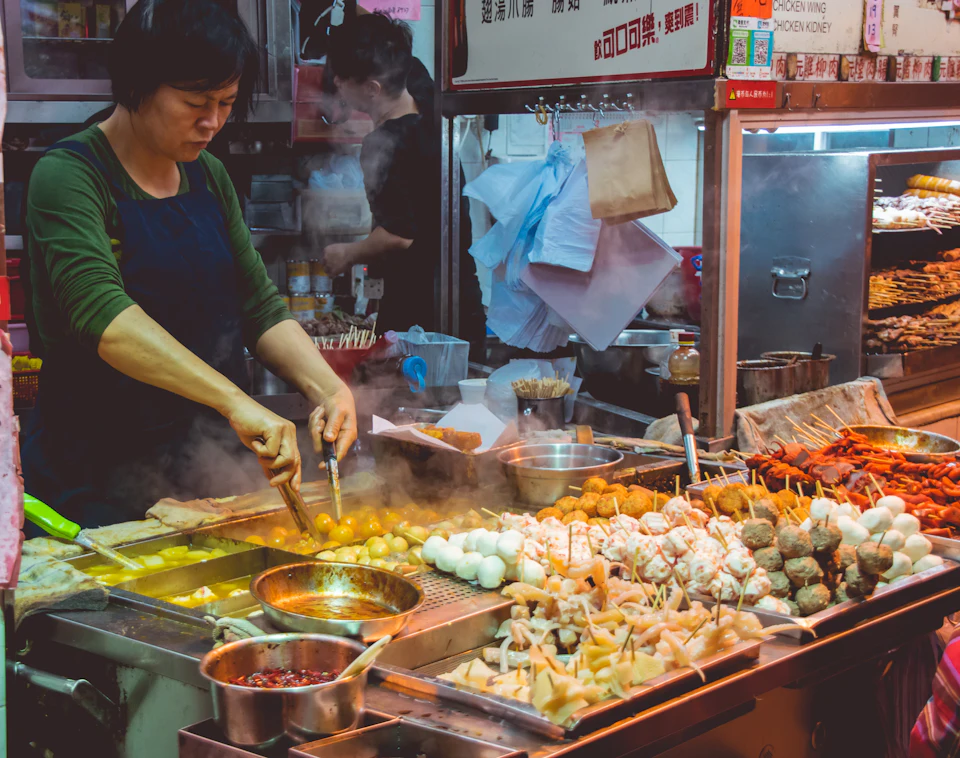 Woman cooking street foods