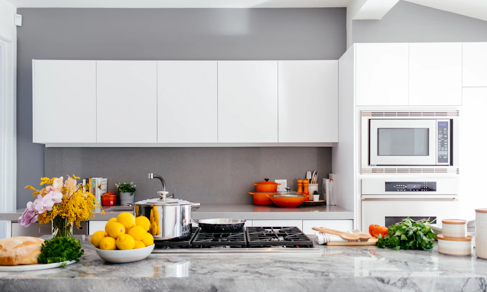 Modern white kitchen with marble island