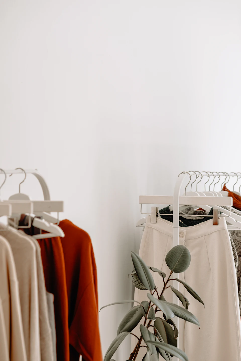 Clothing racks with neutral toned garments