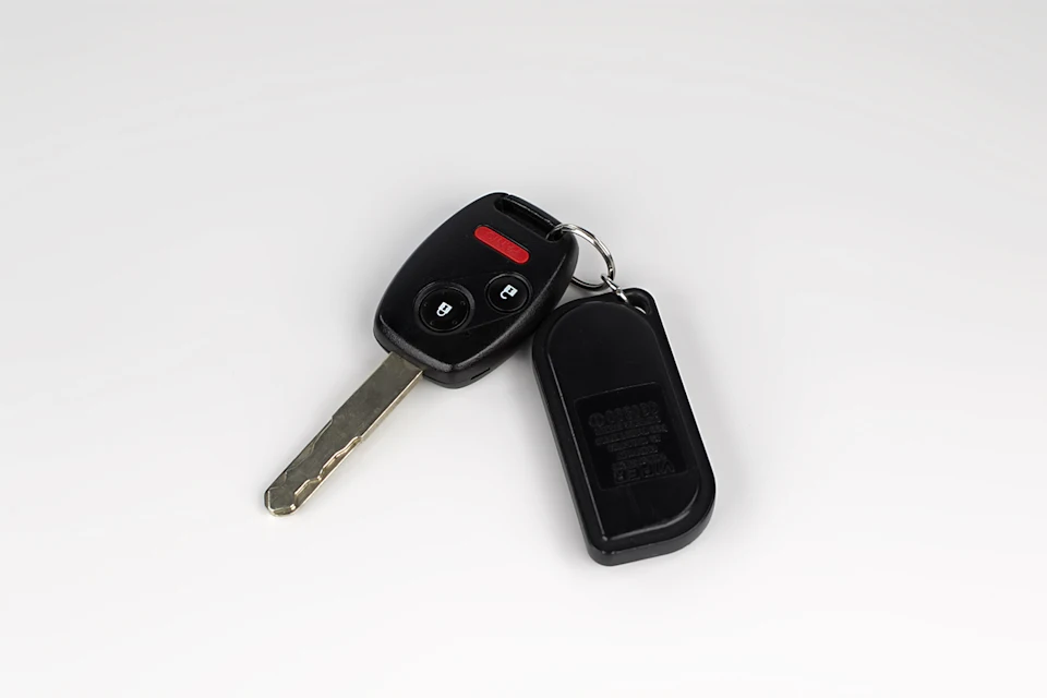 A car key with a remote control attached to it
