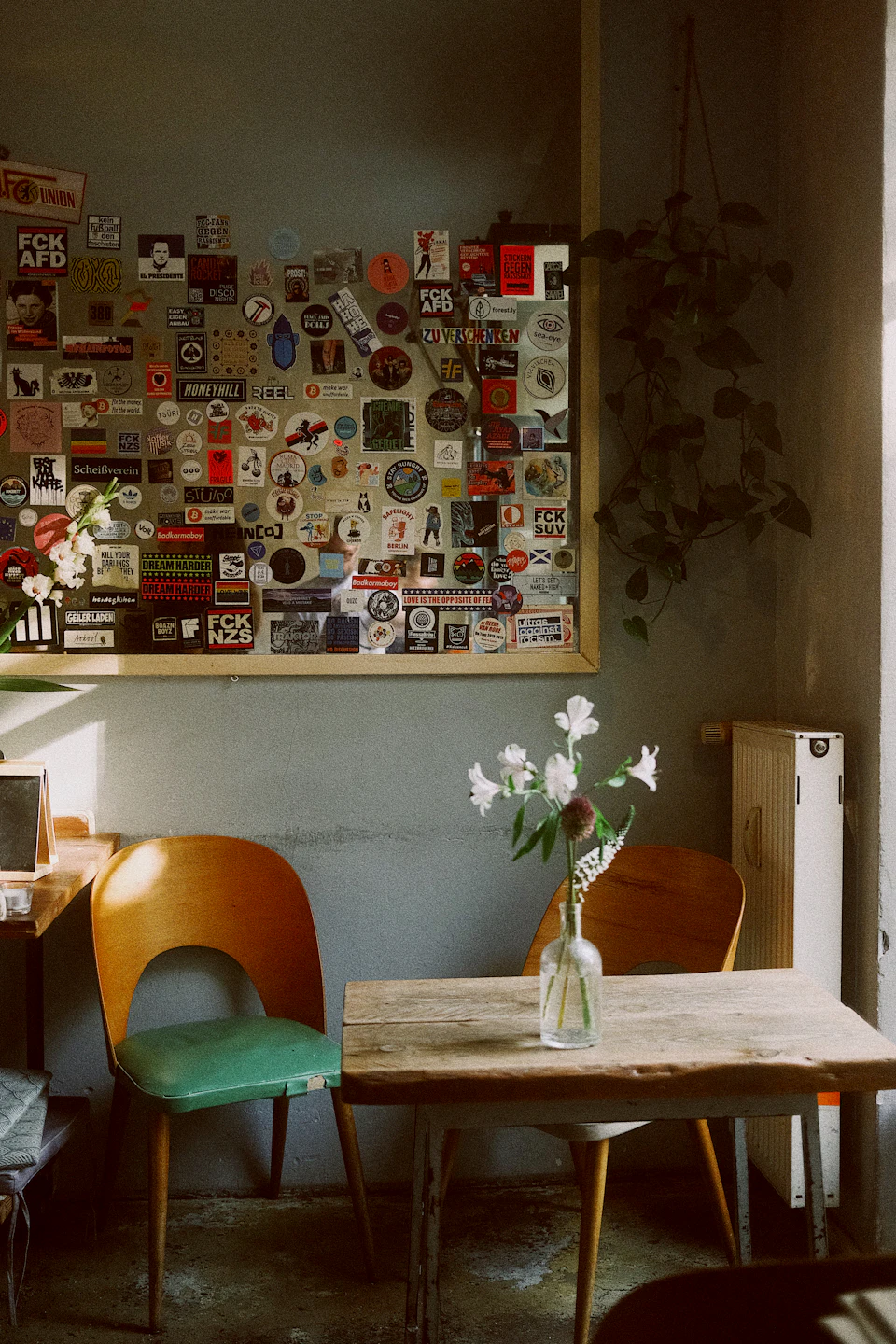 Wooden table with chairs and flower vase