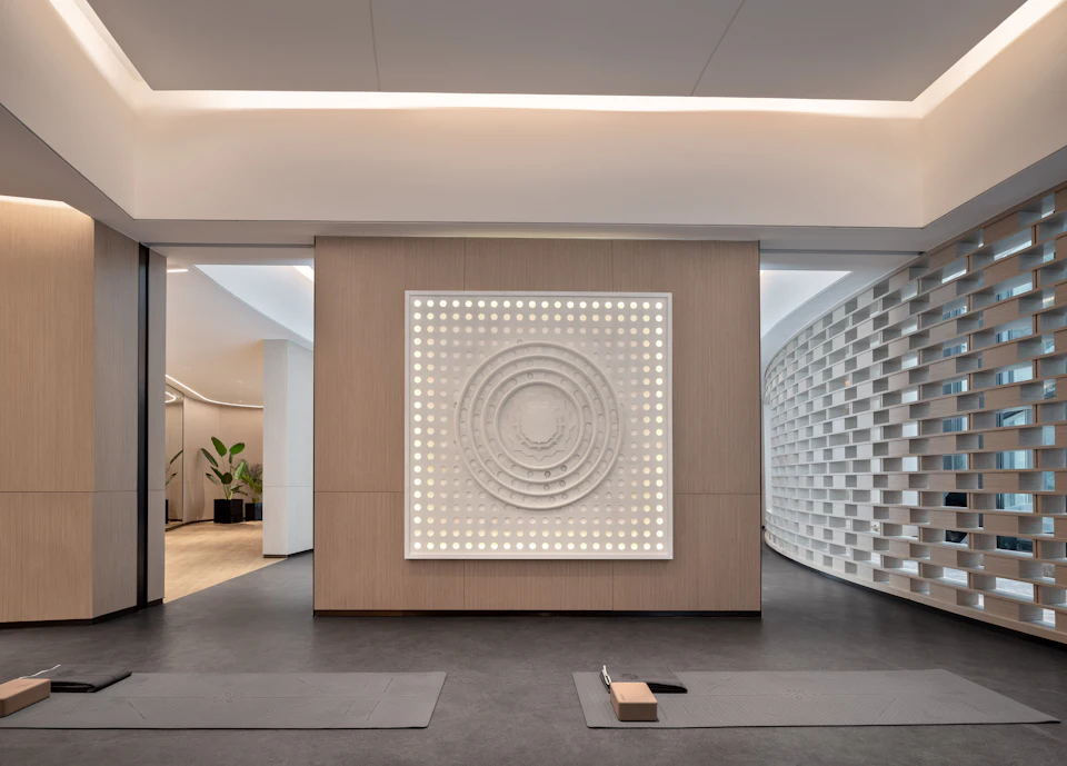 Modern yoga studio with minimalist decor and artwork